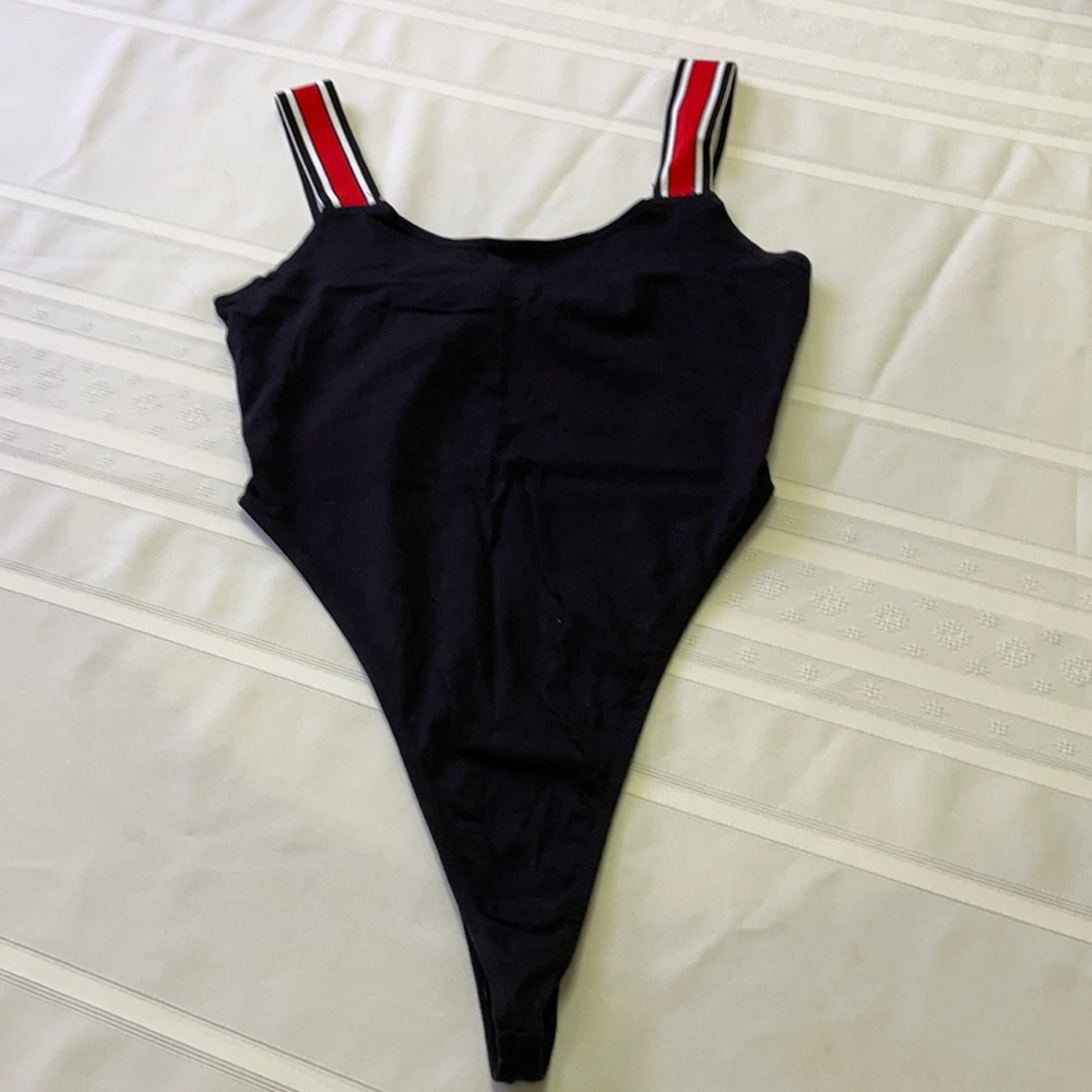 Black bodysuit with elastic black/red/white straps